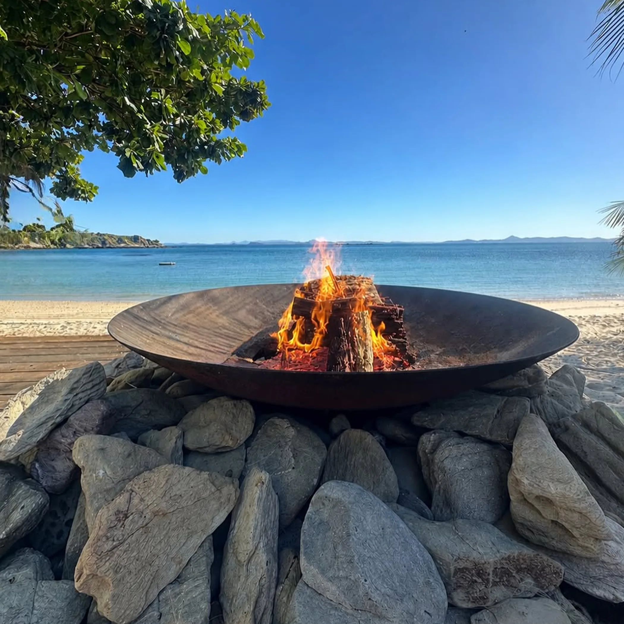 beach fire pit with tropical island scenery